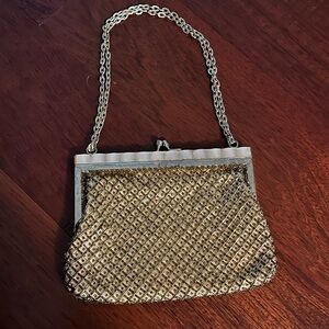 1960’s Vintage Gold Bead Fine Arts Handbag

7” x 5 1/4”
7” strap drop